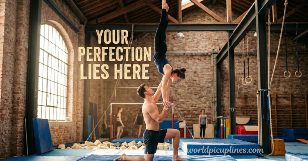 A shirtless male gymnast kneeling while balancing a female gymnast doing a handstand on his hands in a industrial-style gym. The text on the left reads "YOUR PERFECTION LIES HERE," with the website URL worldpicuplines.com displayed in the bottom right corner.
