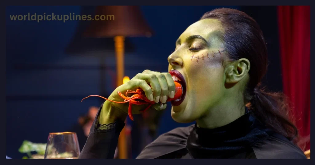 A woman with green skin makeup and facial stitches taking a bite out of a cooked crayfish.